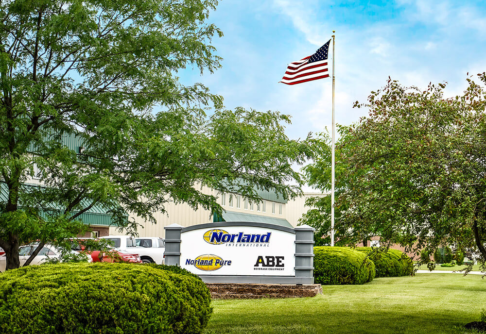 Norland International, Norland Pure, and ABE Equipment sign outside headquarters